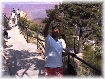 Diann waves to the camera at the Grand Canyon