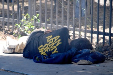 Homeless Vet Sleeping on a Sidewalk